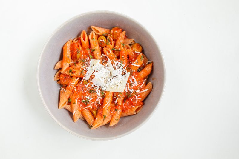 Spicy arrabbiata pasta with fresh herbs